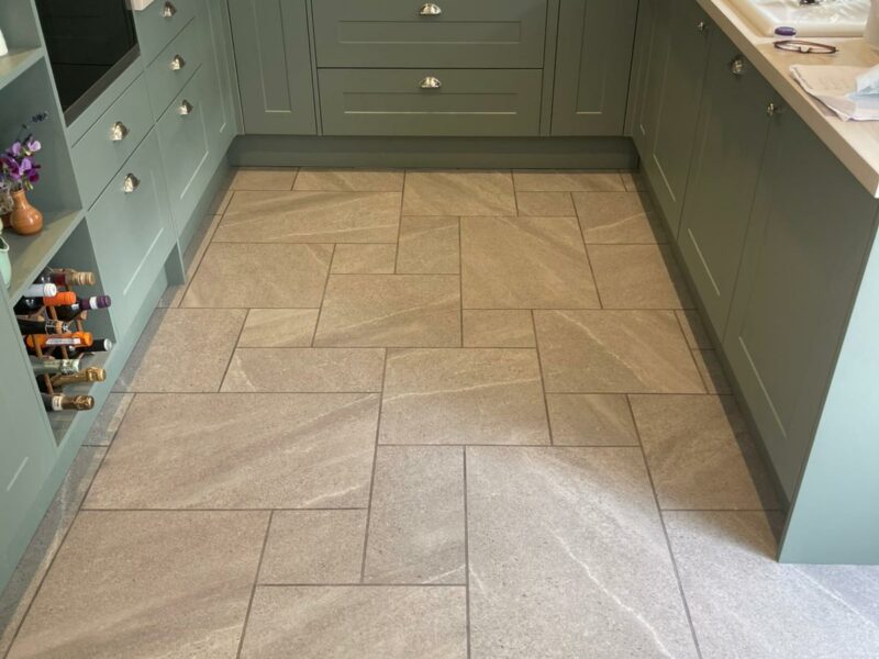 A cool beige large flagstone design floor with Amtico Signature Whitley Stone.